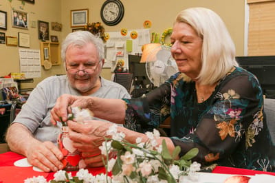 Residents engaged in a craft activity together