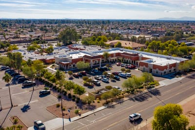 Aerial view of a nursing facility with parking lot.