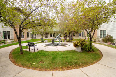 Beautifully landscaped courtyard with fountain and seating