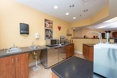 Interior kitchen area with cabinets and appliances