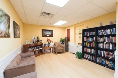 Cozy reading nook with bookshelves and seating