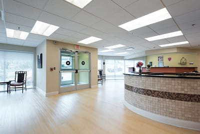 Bright lobby area with seating and reception desk