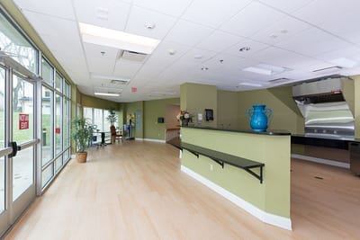 Interior view of a common area with a reception desk