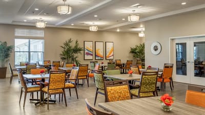 Bright dining area with colorful chairs and tables