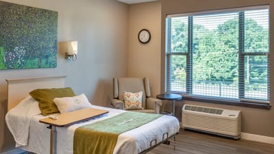 Bright private resident room with a large window