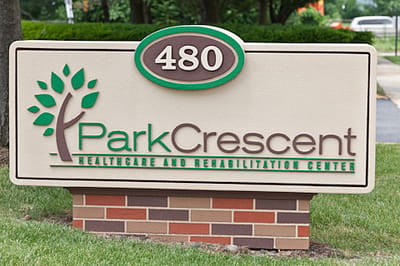 Facility sign displaying name and location
