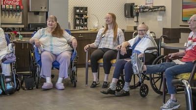 Residents engaged in a seated activity in a common area