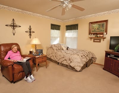 Resident enjoying a cozy room with decor