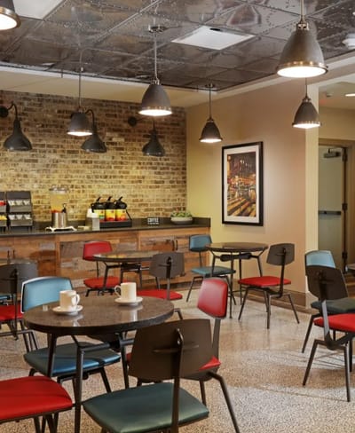 Dining area with tables and chairs in a cozy setting