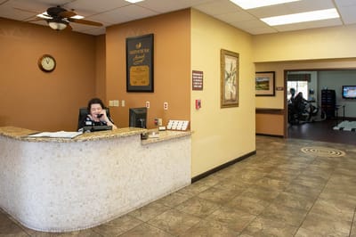 Reception area with staff member at the front desk
