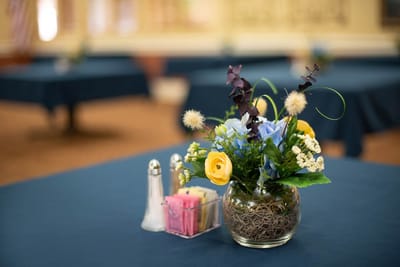 Close-up of a floral centerpiece on a dining table