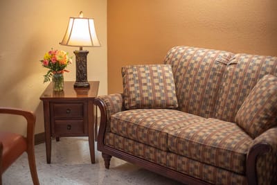 Cozy living room corner with sofa and lamp