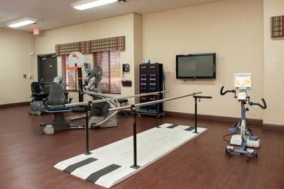 Interior view of a therapy gym with equipment