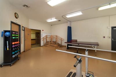 Rehabilitation area with exercise equipment and accessible ramp