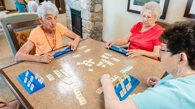 Residents playing a game in a common area