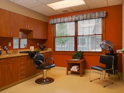 Interior view of a salon area with styling chairs