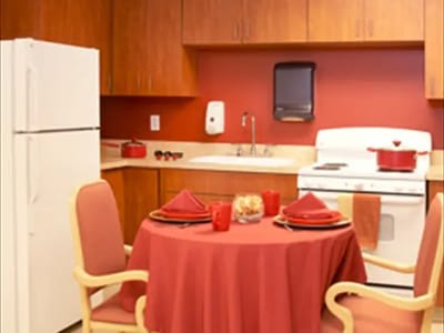 Interior kitchen setup with dining table and chairs