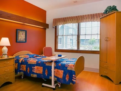 A bright private resident room with colorful decor