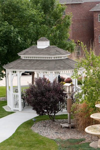 A gazebo in a landscaped outdoor area