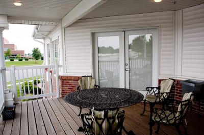Outdoor patio area with a table and chairs