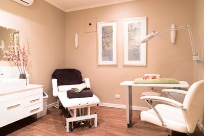 Interior spa treatment room with chairs and decor