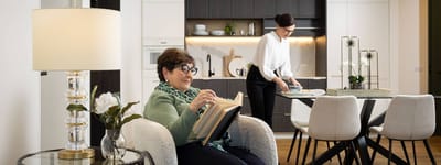 Resident reading in a bright, modern interior space