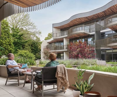 Residents enjoying the outdoor space in front of the building