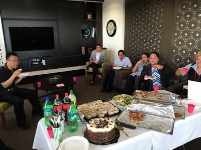 Staff and residents enjoying a meal in a common area