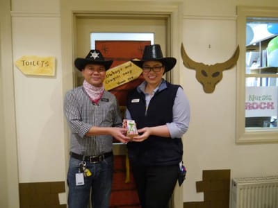 Staff members celebrating with a small award