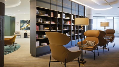Cozy interior lounge area with bookshelves and seating