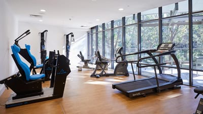 Bright fitness room with exercise equipment