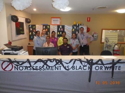 Staff members at the reception desk with decorations