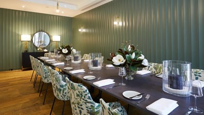 Elegant dining room with floral decor and table settings