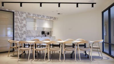 Bright interior of a common area with a large table
