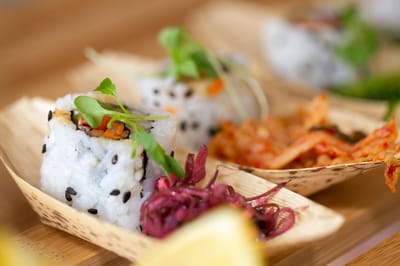 Close-up of sushi rolls with garnishes