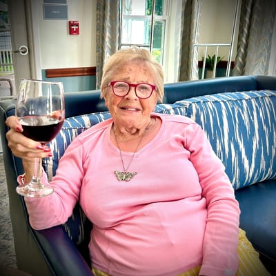 Resident enjoying a drink in a common area