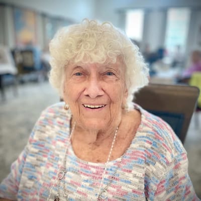 Portrait of a smiling resident in a common area