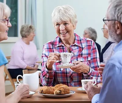 Residents enjoying tea and pastries together