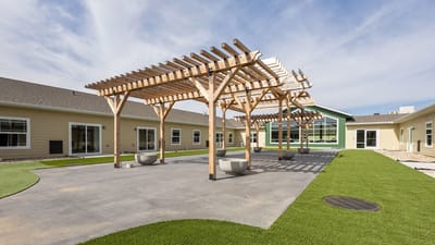 Outdoor courtyard with wooden structures and greenery