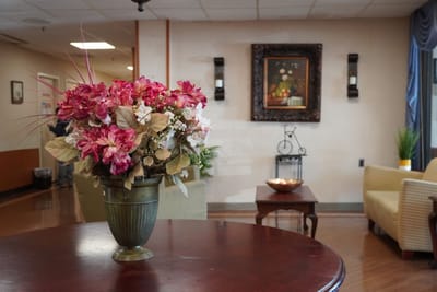 Interior view of a common area with floral arrangement