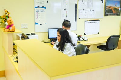 Staff members working at a reception area