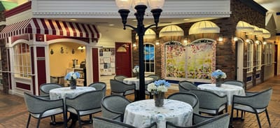 Interior view of a communal dining area with tables and decorations