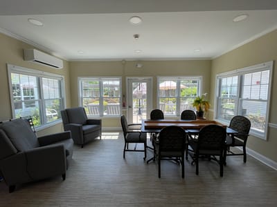 Common area with a dining table and seating