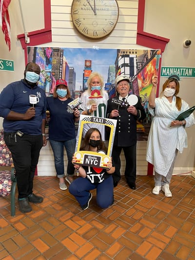 Residents and staff celebrating in a common area