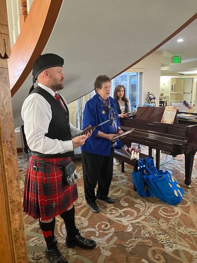 Residents engaging with performers in a common area
