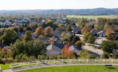 Scenic view of residential community with autumn foliage.