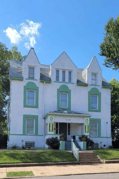 Exterior view of Smiley Manor with green accents