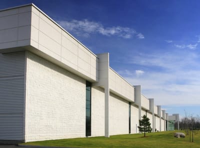 Exterior view of a modern building with landscaping.
