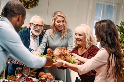 Residents and staff celebrating a holiday meal together