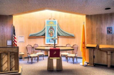 Interior view of a chapel with chairs and decor